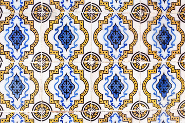 Traditional ornate portuguese decorative tiles azulejos in white, brown and blue colours.