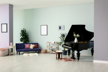 Black grand piano in interior of room