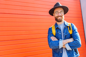 Portrait of happy excited hipster man traveler