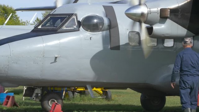 Twin-engine aircraft Let L-410 "Turbolet" rides on a green field