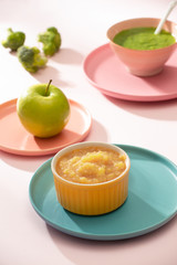 Natural baby food concept. Bowl of apple baby puree.