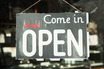 Open Sign in a Shop Window