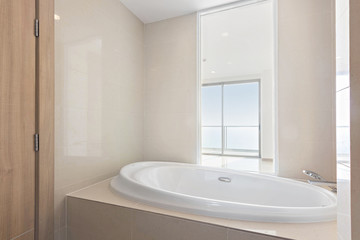 Naklejka na ściany i meble Clean and white Bathroom with Amenities in Luxurious Apartment.
