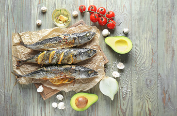 Baked mackerel fish on wooden table