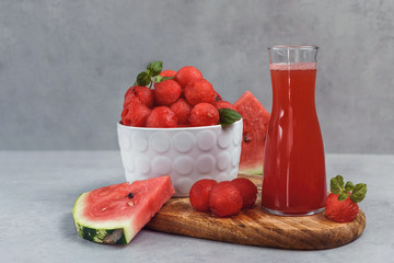 Fruit salad with watermelon balls and mint.  Fresh watermelon vegetarian vitamin juice.