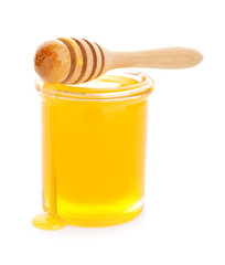 Jar of sweet honey on white background