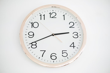 Round wall clock with white body isolated