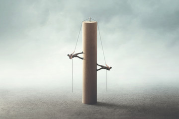 two men climbing the tower with a rope