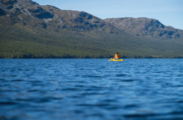 Kayak on a large lake in a scandinavian wilderness. Ottsjon, Sweden.