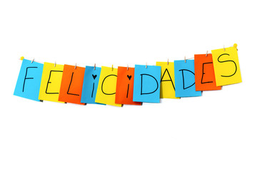  "Felicidades" Spanish word that means congratulations written by children in colorful pages
