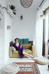 female with short haircut poses in Tbilisi loft