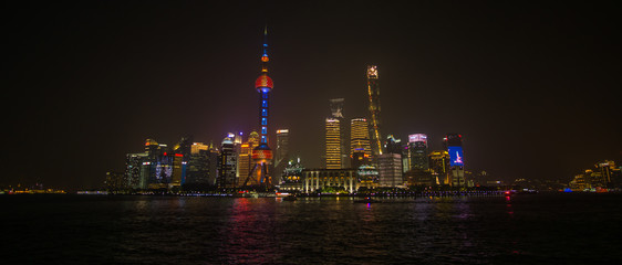 Fototapeta na wymiar A Beautiful night around the Bund area in Shanghai city , this viewpoint offers the best spot for watching the spectacular skyline of this massive city with the most famous shanghai tower.