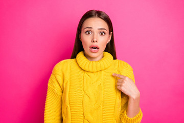 Portrait of impressed lady showing at herself staring wearing yellow knitted pullover isolated over...