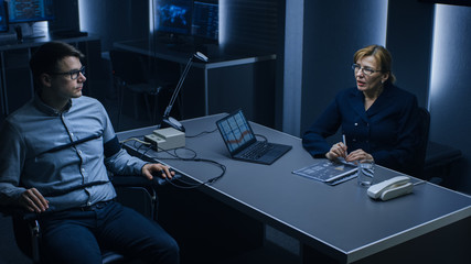 Female Special Agent Conducts Lie Detector / Polygraph Test on a Young Suspect. Expert Examiner...
