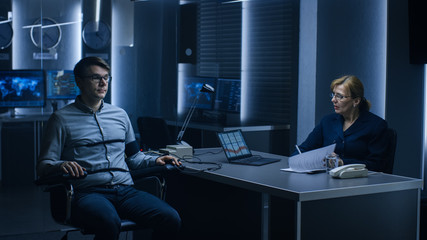 Female Special Agent Conducts Lie Detector / Polygraph Test on a Young Suspect. Expert Examiner Questions Accused in Interrogation Room Writes Down Reactions. - obrazy, fototapety, plakaty
