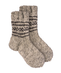 Knitted socks made of wool with ornament on an isolated white background