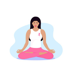 Fototapeta na wymiar National Breast Cancer Awareness Month. Young woman with a pink ribbon on her chest is meditating