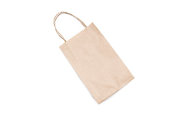 Empty kraft paper bag made from recycled paper on a white background