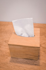 Wood tissue box on wood table 45 degree angle