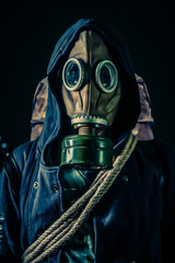 Post apocalyptic concept.Studio shot of man in gas mask.
