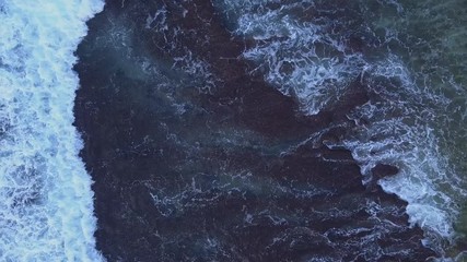 Aerial: Above the ocean, aerial view at the waves and surface, fly cam move  above waves