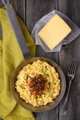 Cheese spätzle on wood background