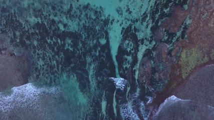 Aerial: Above the ocean, aerial view at the waves and surface, fly cam move  above waves