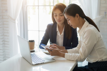 Business team brainstorming and discussing with financial data and report graph. Teamwork meeting working concept.