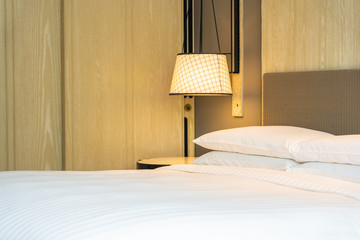 White comfortable pillow on bed decoration