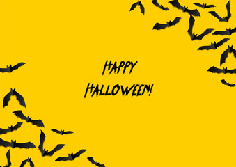 Halloween greeting card with black bats on yellow background