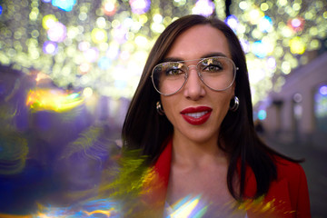 Woman on a background of the night city. Look amazing in red lipstick             