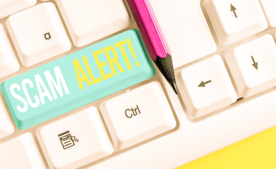 Handwriting text writing Scam Alert. Conceptual photo fraudulently obtain money from victim by...