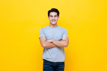 Handsome man standing with crossed arms gesture