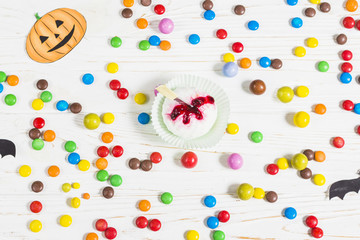 Mini muffin between little colourful candies