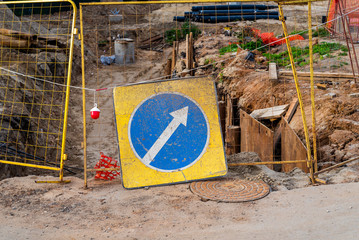 Road sign indicating a detour. Repair work on the road. Construction.