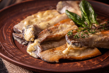 Oyster mushrooms, pleurotus eryngii cooked with cream and thyme and serving with spinach sauce on plate. Delicious and healthy food