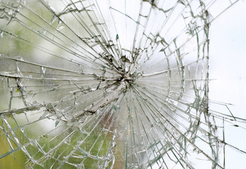 Old cracked dirty broken glass window background.