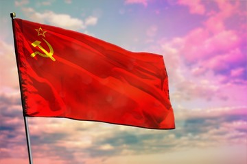 Fluttering Soviet Union (SSSR, USSR) flag on colorful cloudy sky background. Prosperity concept.