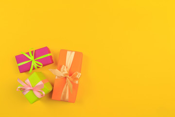 Different colored gift box on color background. Top view of various present boxes on minimal background. Birthday, Christmas, wedding, valentine, romantic gifts - Image