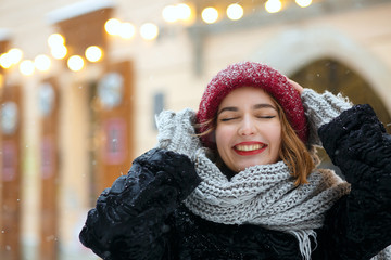 Alluring young woman walking in snowy weather