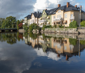 Obraz premium Houses by the river. Orebro city center. Travel photo, background image or illustration.