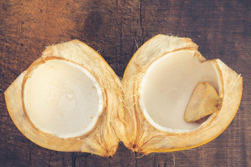 fresh halved coconut, full of white flesh and ready to eat