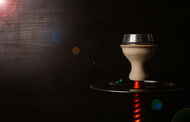 smoke hookah on a black background with a beautiful smoke