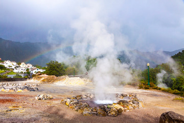 Fototapeta na wymiar Hot thermal springs in Furnas village, Sao Miguel island, Azores, Portugal. Caldeira Grande (translates from Portuguese as Big Boiler)