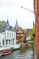 Fototapeta premium BRUGES, BELGIUM - April 13, 2018: Street view of downtown in Bruges, Belgium