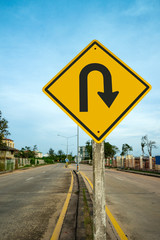 u-turn traffic  sign  with blue sky background