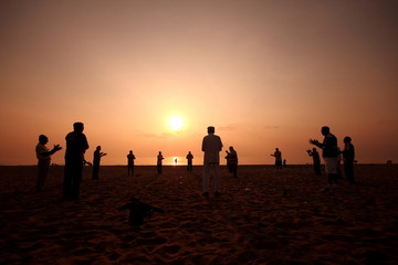 Fototapeta na wymiar People doing exercise during Sunrise