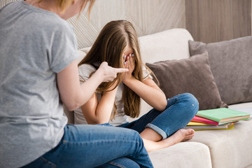 Mother scolds school crying daughter for homework