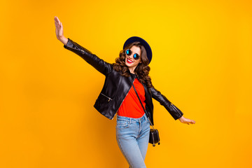Photo of funny lady spread hands pretending air flight to warm countries wear casual outfit isolated yellow background