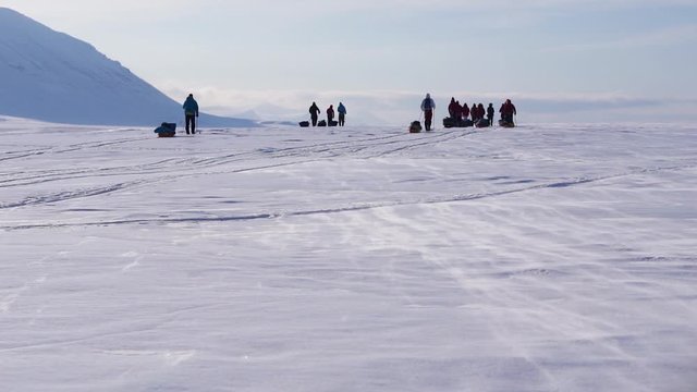 A clip of a group of people skiing in the Arctic. Filmed at Svalbard.